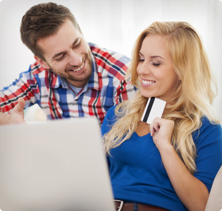 happy couple with laptop